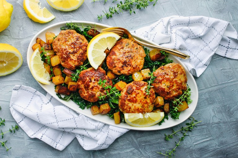 Pan-seared BC ground turkey patties with lemon zest and fresh thyme, golden brown and plated