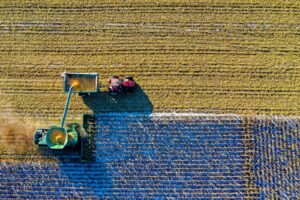 farmers harvesting of crops with machines