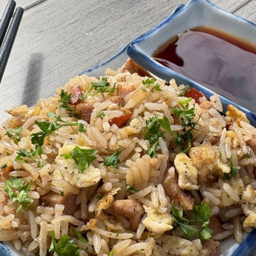 Wok-fried rice with smoked BC turkey cutlets, farmers sausage, egg, and green onions in a soy sesame sauce