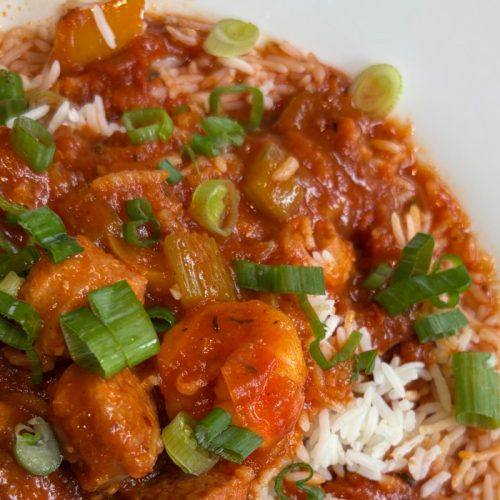 One-pot BC turkey jambalaya with smoked cutlets, chorizo sausage, bell peppers, and rice in a rich Cajun tomato broth