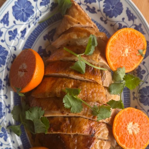 Pan-seared BC ground turkey patties with lemon zest and fresh thyme, golden brown and plated
